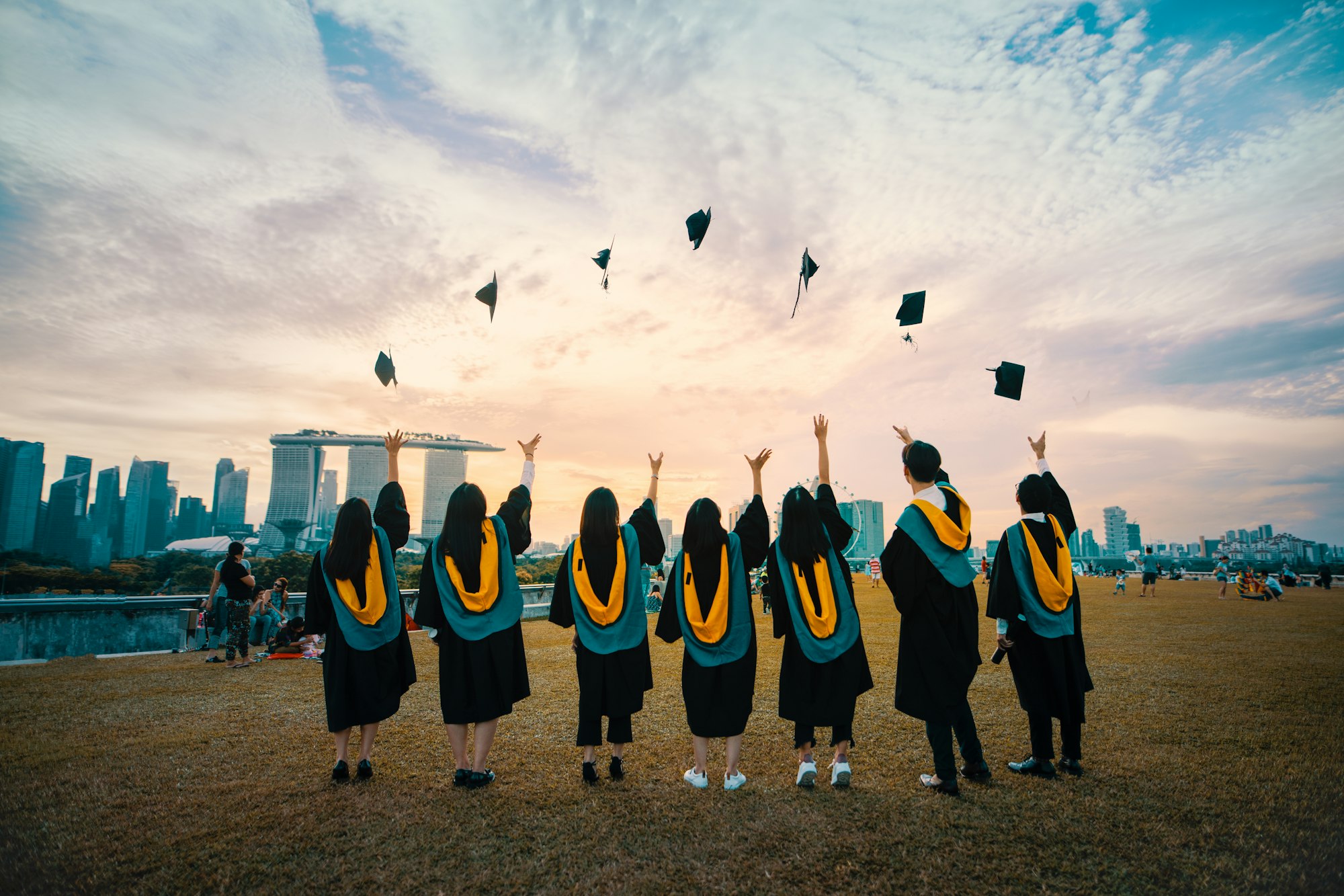 Graduates throwing their caps in the air